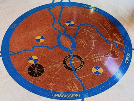 Rivers is a public art installation at Schomburg Center  for Research in Black Culture. The cosmogram was designed  by Houston Conwill in honor of Langston Hughes and Arturo A.  Schomburg (terrazzo and brass, 1991).
